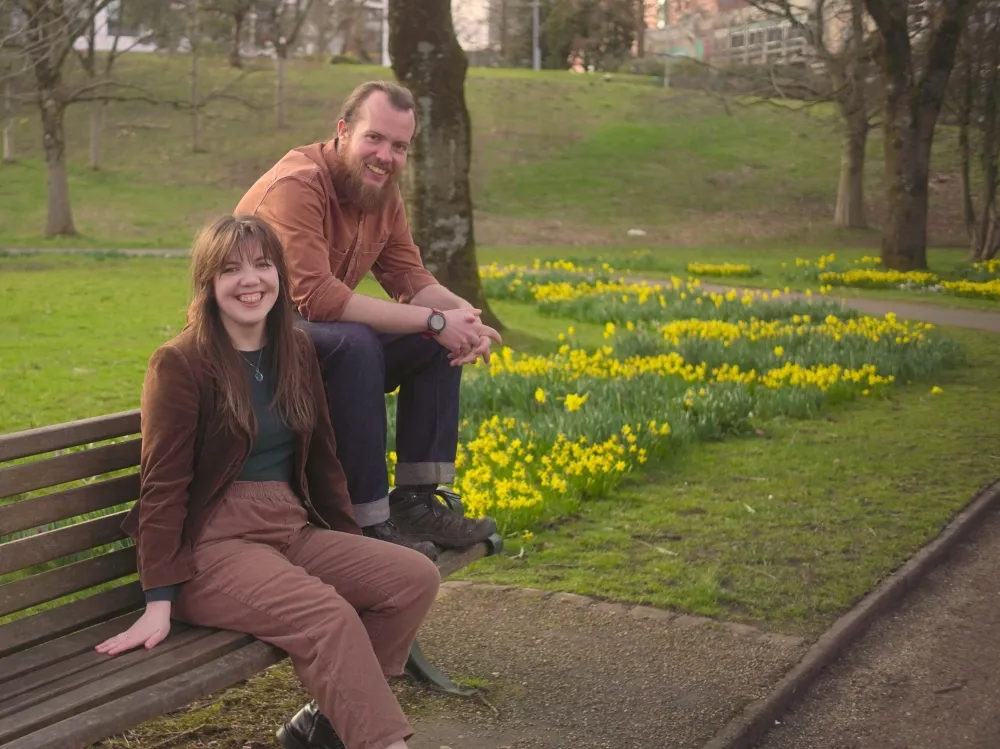 An image of two people in the countryside.